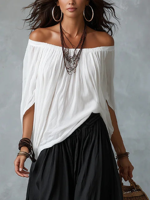 Conjunto de top blanco con hombros descubiertos y pantalones acampanados estilo farol