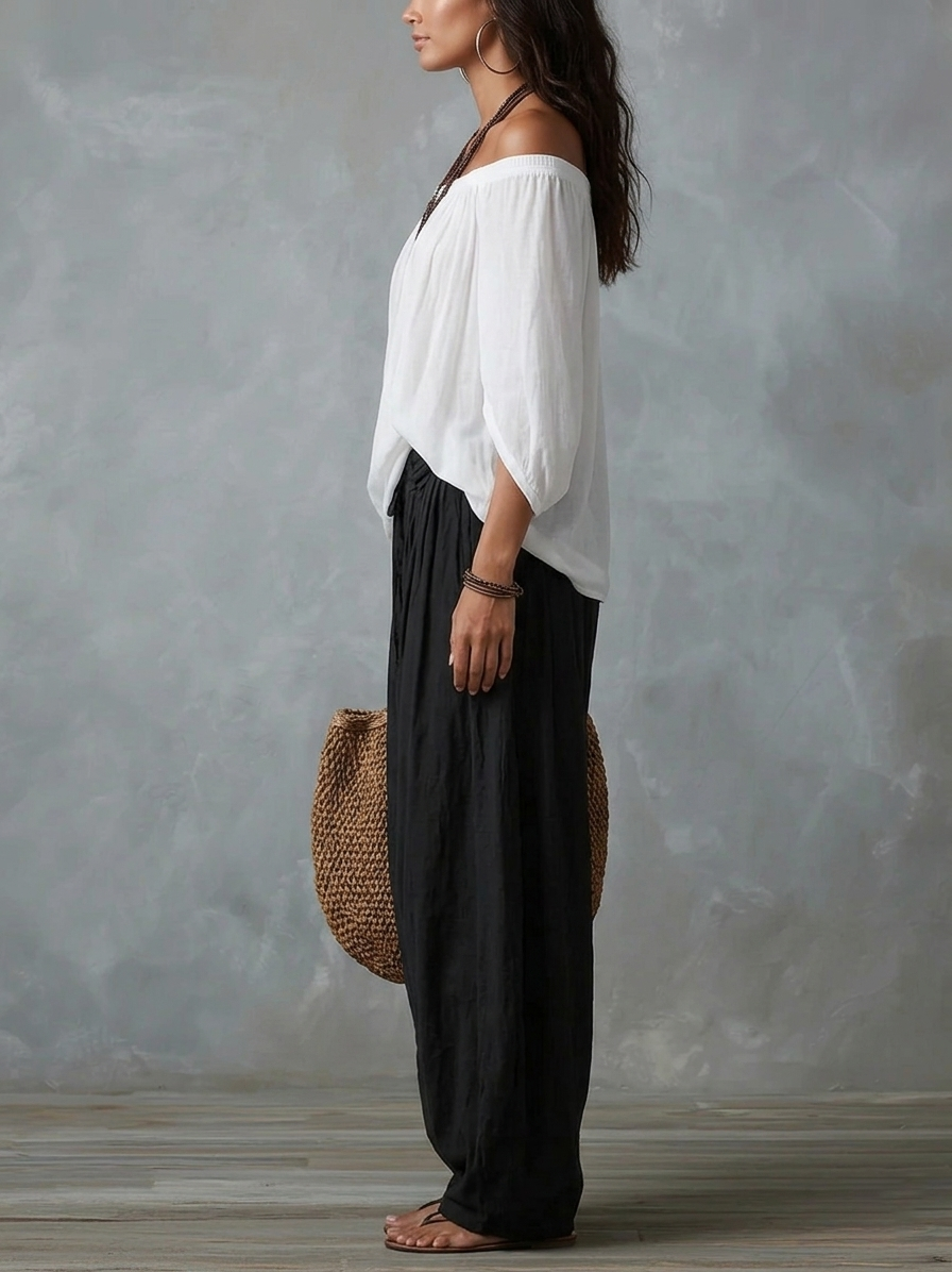 Conjunto de top blanco con hombros descubiertos y pantalones acampanados estilo farol